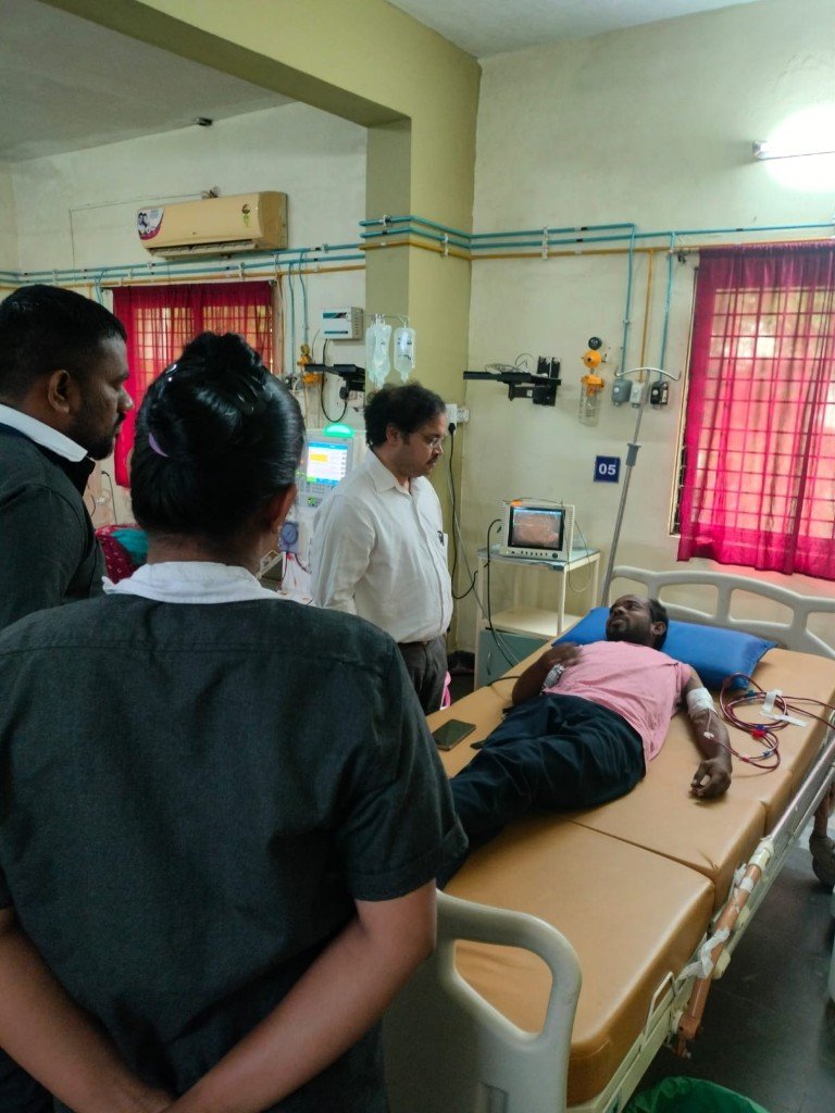 Patient undergoing dialysis with doctor and clinical staff present